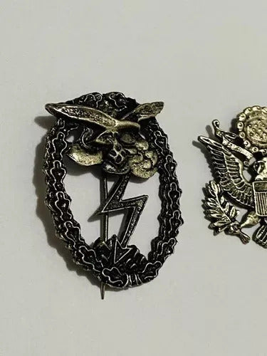 Second World War German military badge featuring eagle and lightning bolt with laurel wreath design