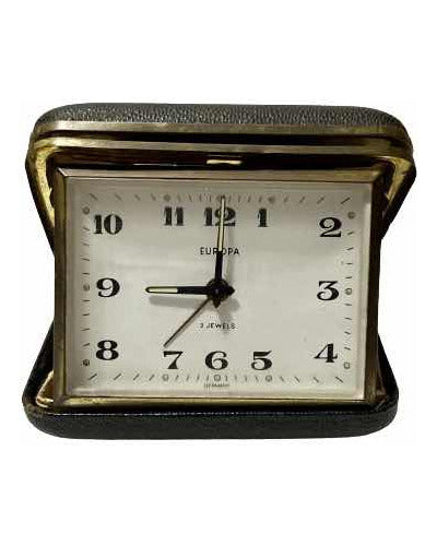 Vintage German Europa travel clock with 2 jewels, black leather case, and classic white dial with black numbers