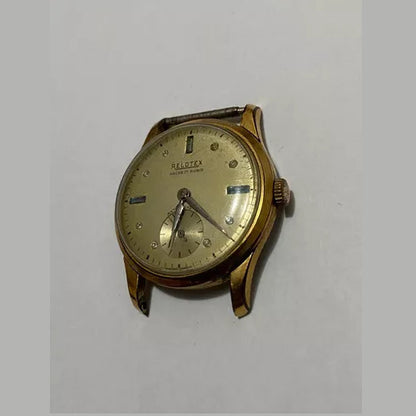 Vintage Relotex Ancre wristwatch with 17 rubies, gold-toned case, and classic analog dial, shown without strap.