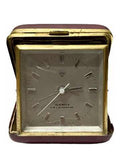 Vintage Shanghai China clock with 15 jewels, gold-tone frame, and classic square face in protective case
