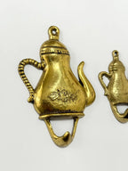 2 Ganchos De Parede Antigos Em Metal Dourado Formato Bule