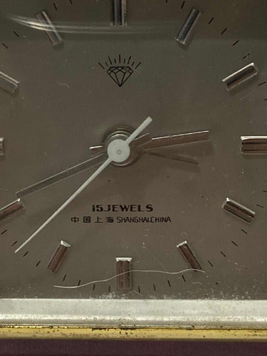 Close-up of antique Shanghai China 15 jewels wristwatch dial with silver hour markers and hands