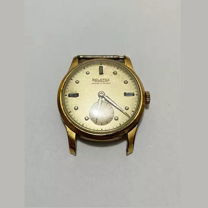 Vintage Relotex Ancre 17 Rubis wristwatch with gold-tone case and classic round dial in worn condition.